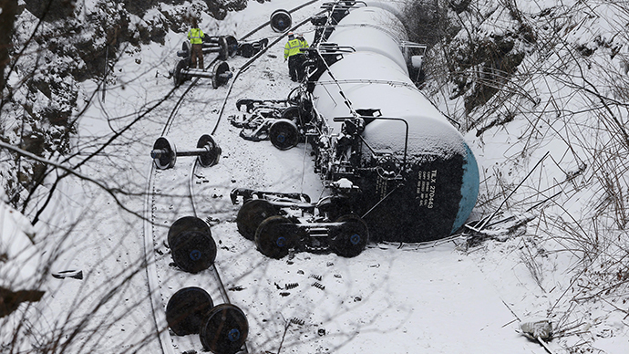 Penn. train derailment leaks thousands of gallons of oil, sends car into building