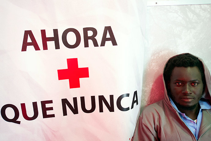 A would-be immigrant looks on as he rests in a local of the Spanish emergency services after being rescued off the Spanish coast and led to Tarifa, on October 7, 2013. (AFP Photo / Marcos Moreno)