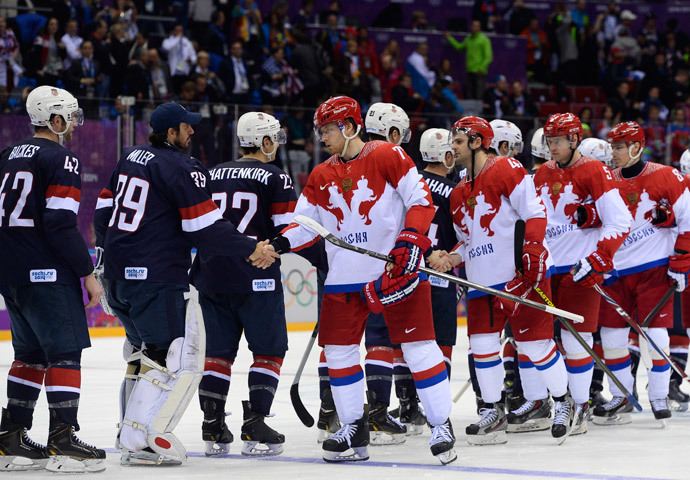US and Russia's players shake hands after a penelty shootout at the end of the Men's Ice Hockey Group A match USA vs Russia at the Bolshoy Ice Dome during the Sochi Winter Olympics on February 15, 2014 in Sochi. US won 3-2 in the penalty shootout.(AFP Photo / Jonathan Nackstrand)