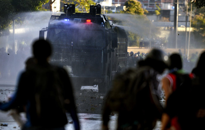 A water cannon attempts to break-up anti-government students during a protest in Caracas on February 15, 2014.( AFP Photo / Juan Barreto )