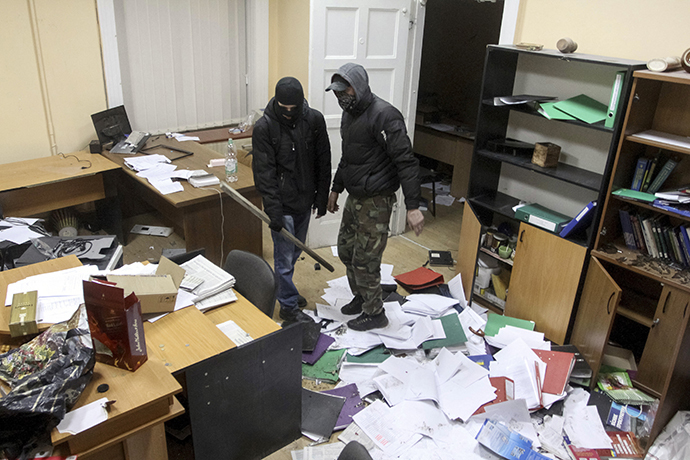 Anti-government rioters are seen inside the destroyed prosecutor's office in Lviv February 19, 2014. (Reuters / Marian Striltsiv)