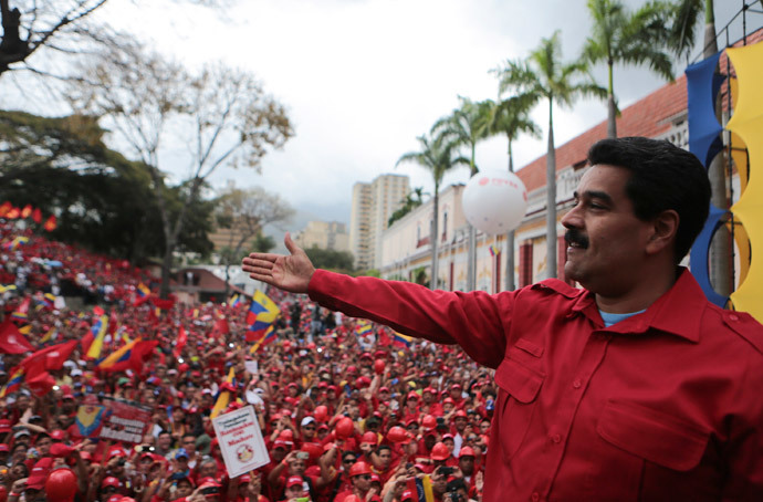 Venezuela's President Nicolas Maduro greets supporters during a rally in Caracas February 18, 2014.(Reuters / Miraflores Palace)