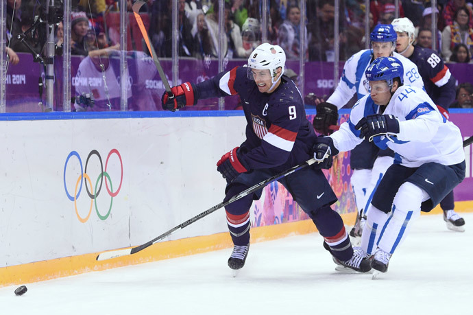 US Zach Parise (L) vies with Finland's Kimmo Timonen during the Men's ice hockey Bronze Medal Game USA vs Finland at the Bolshoy Ice Dome (AFP Photo / Andrej Isakovic) 