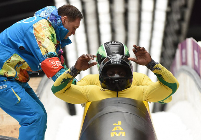 Jamaica-1 two-man bobsleigh pilot Winston Watts and brakeman Marvin Dixon compete in the Bobsleigh Two-man Heat 3 at the Sliding Center Sanki during the Sochi Winter Olympics on February 17, 2014. (AFP Photo / Leon Neal)