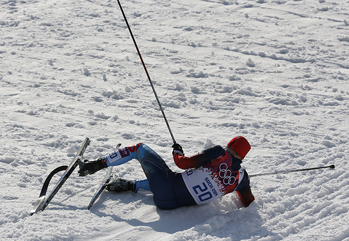 Russia's Anton Gafarov lies on the ground after crashing in the men's cross-country sprint semi-final at the Sochi 2014 Winter Olympic Games in Rosa Khutor February 11, 2014. (Reuters / Stefan Wermuth)