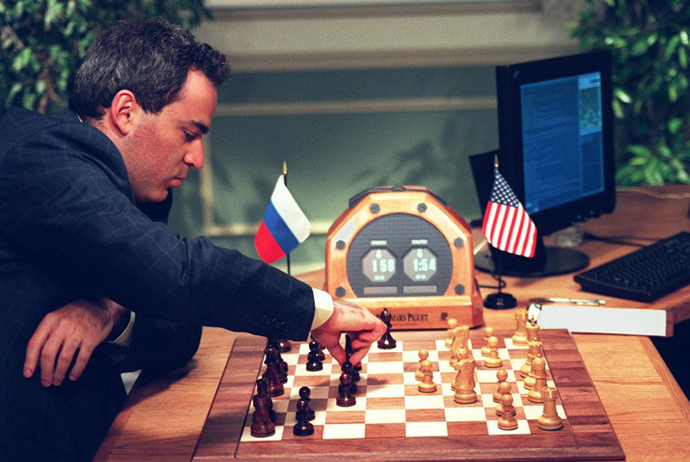World Chess Champion Garry Kasparov makes a move 07 May in New York during his fourth game against the IBM Deep Blue chess computer, 1997 (AFP Photo / Stan Honda)
