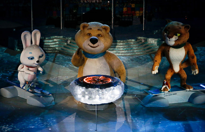 Olympic Games mascots extinguish Olympic flame in a small cauldron in the stadium during the closing ceremony for the 2014 Sochi Winter Olympics, February 23, 2014. (Reuters / Eric Gaillard)