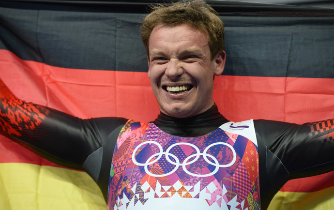 Germany's Felix Loch celebrates his Gold Medal in the Men's Luge final at the Sanki Sliding Center during the Sochi Winter Olympics on February 9, 2014. (AFP Photo / Lionel Bonaventure)