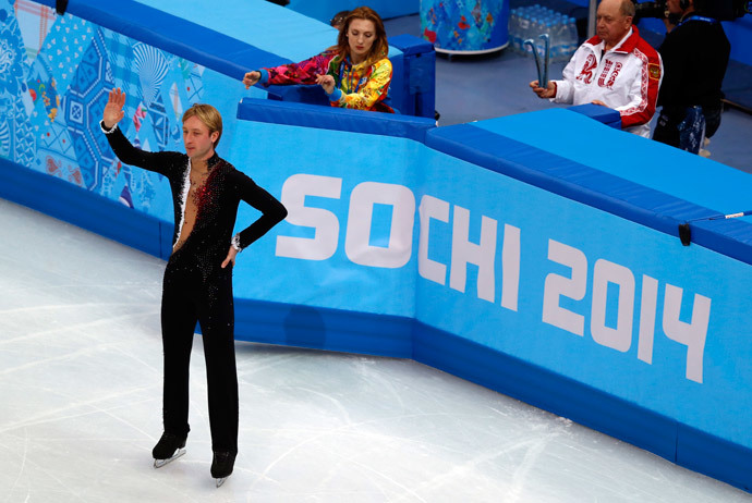 Russia's Yevgeny Plushenko waves to the crowd during a warm-up at the Men's Figure Skating Short Program at the Iceberg Skating Palace during the Sochi Winter Olympics on February 13, 2014. (AFP Photo / Adrian Dennis)