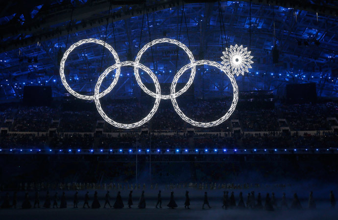Participants march by as one of the Olympic Rings fails to completely illuminate during the opening ceremony of the 2014 Sochi Winter Olympics, February 7, 2014. (Reuters / Phil Noble)