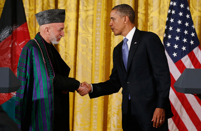 Afghan President Hamid Karzai (L) shakes hands with U.S. President Barack Obama (R) (Reuters / Larry Downing)