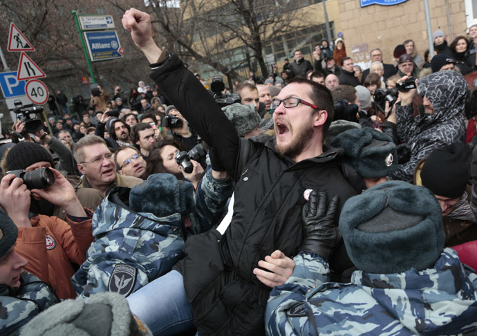 Police detain an opposition supporter outside Moscow's Zamoskvoretsky Court where the verdict is to be announced in the Bolotnaya Square case involving mass riots in Moscow on May 6 2012. (RIA Novosti/Aleksey Nichukchin)