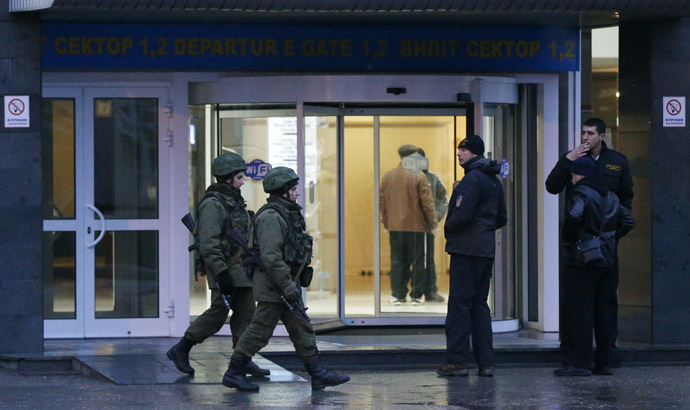 Armed men patrol at the airport in Simferopol, Crimea February 28, 2014. (Reuters/David Mdzinarishvili)