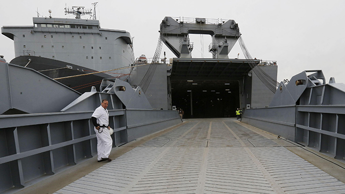 The Captain of the MV Cape Ray, Rick Jordan, walks onboard the ship at the NASSC0-Earl Shipyard in Portsmouth, Virginia, January 2, 2014. Inside sits the The Field Deployable Hydrolysis System used to destroy and neutralize chemical weapons. (Reuters / Larry Downing)