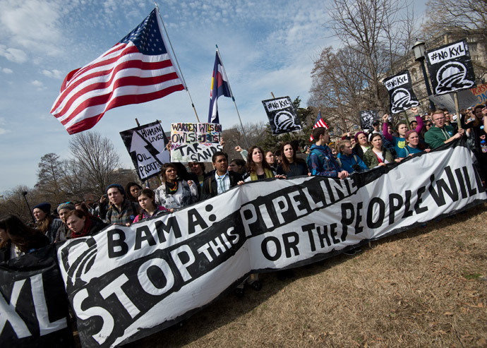 Students protesting against the proposed Keystone XL pipelinerally in Lafayette Park across from the White House in Washington,DC on March 2, 2014.(AFP Photo / Nicholas Kamm)
