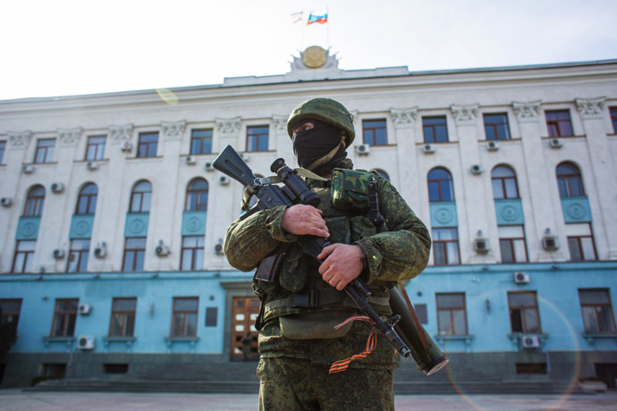 A soldier outside the Crimean legislature building in Simferopol. (RIA Novosti/Andrey Stenin)