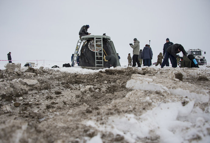 The Soyuz TMA-10M capsule is seen shortly after it landed with former ISS commander Oleg Kotov and flight engineers Sergei Ryazansky and Michael Hopkins from NASA onboard in a remote area southeast of the town of Zhezkazgan in central Kazakhstan, March 11, 2014. (Reuters / Bill Ingalls / NASA / Handout via Reuters) 
