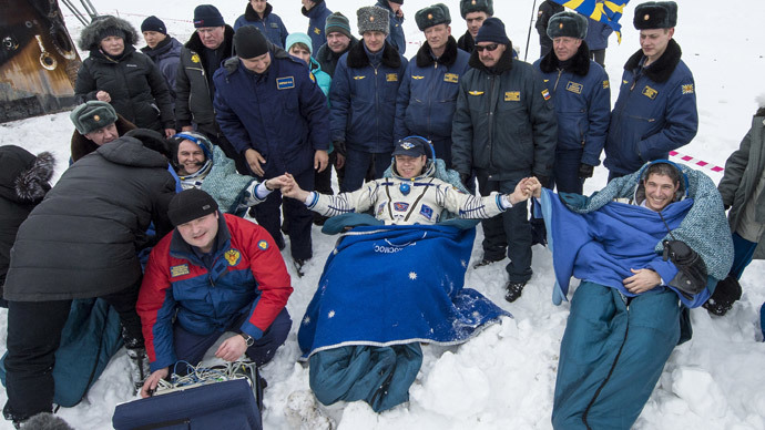 Russia's Soyuz brings ISS crew back to Earth