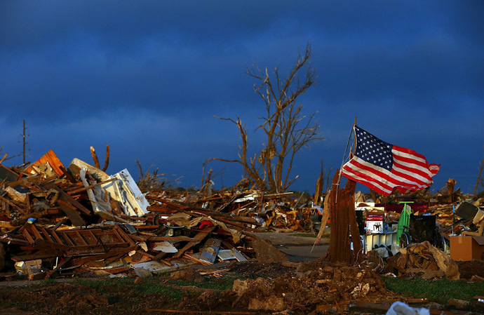 The sun rises over a tornado ravaged home early on May 27, 2013 in Moore, Oklahoma. (Tom Pennington/Getty Images/AFP)