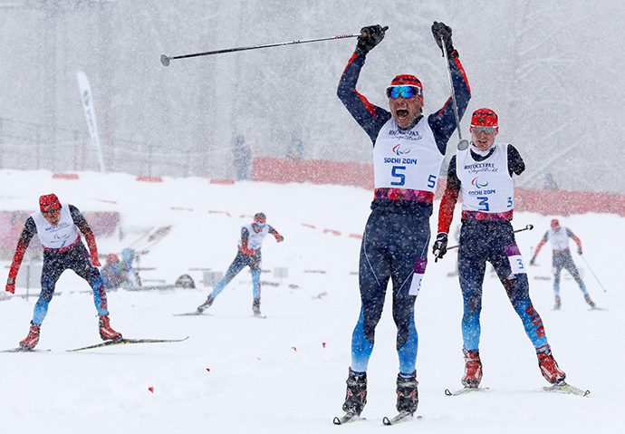 Russia's Kirill Mikhaylov celebrates his gold medal win during the men's 1 km sprint cross-country standing at the 2014 Sochi Paralympic Winter Games in Rosa Khutor, March 12, 2014 (Reuters / Alexander Demianchuk)