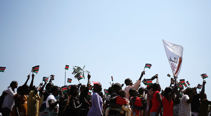 People wave South Sudanese flags as they celebrate referendum results in town of Abyei October 31, 2013.(Reuters / Goran Tomasevic)