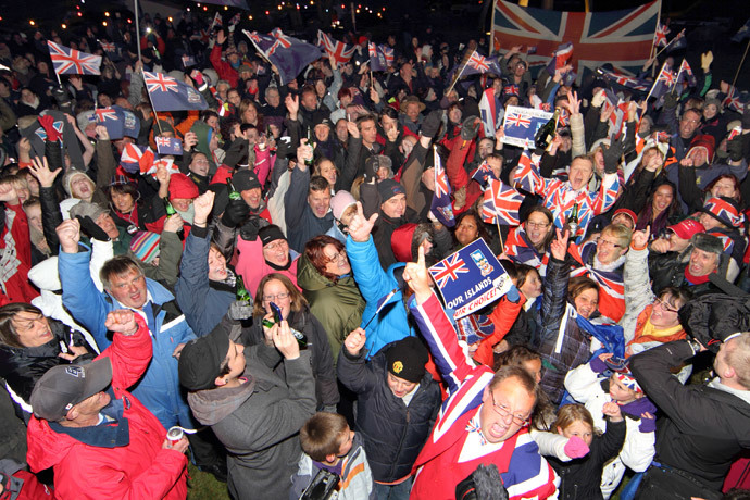 Islanders celebrate after the annouce of the referendum's result in Port Stanley, Falkland (Malvinas for Argentina) Islands, on March 11, 2013.(AFP Photo / Tony Chater)