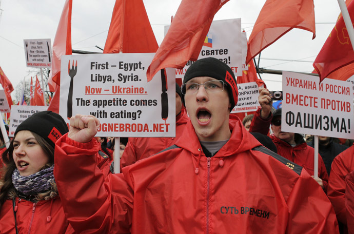 People shout slogans during a rally, part of the "Brotherhood and Civil Resistance March", in central Moscow March 15, 2014. (Reuters/Tatyana Makeyeva)