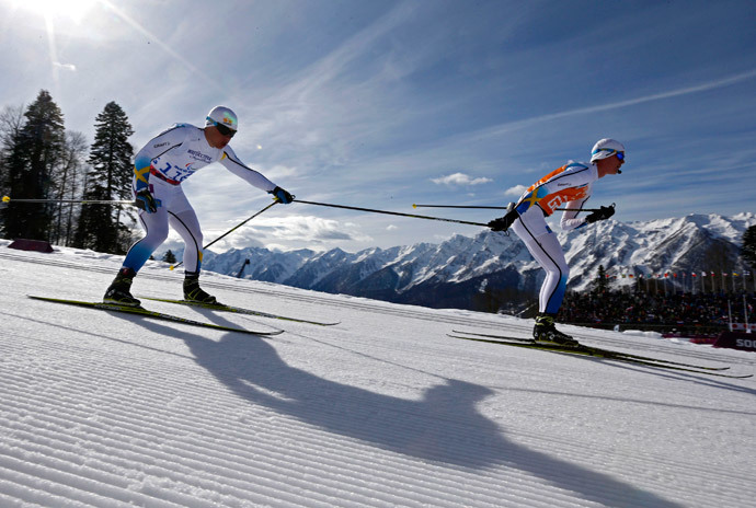 Sweden's Zebastian Modin (L) and his guide Albin Ackerot ski during the men's 10 km cross-country for the visually impaired at the 2014 Sochi Paralympic Winter Games in Rosa Khutor, March 16, 2014. (Reuters / Alexander Demianchuk)