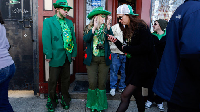 Spectators in costume watch the annual South Boston St. Patrick's Day parade in Boston, Massachusetts March 16, 2014.(Reuters / Dominick Reuter)