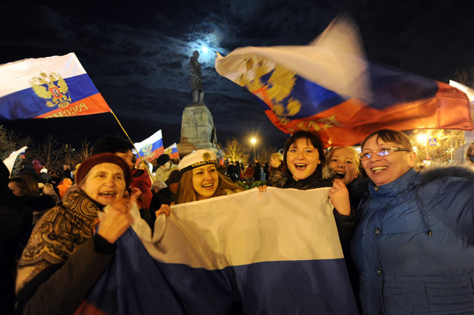 Pro-Russian Crimeans celebrate in Sevastopol on March 16, 2014 after partial showed that about 95.5 percent of voters in Ukraine's Crimea region supported union with Russia.(AFP Photo / Viktor Drachev)