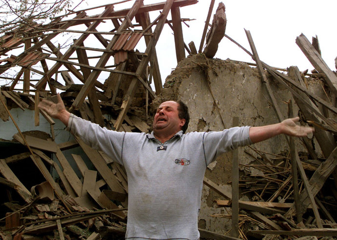 A man in front of his house after a daylight May 7 NATO raid over Nis. (Reuters)