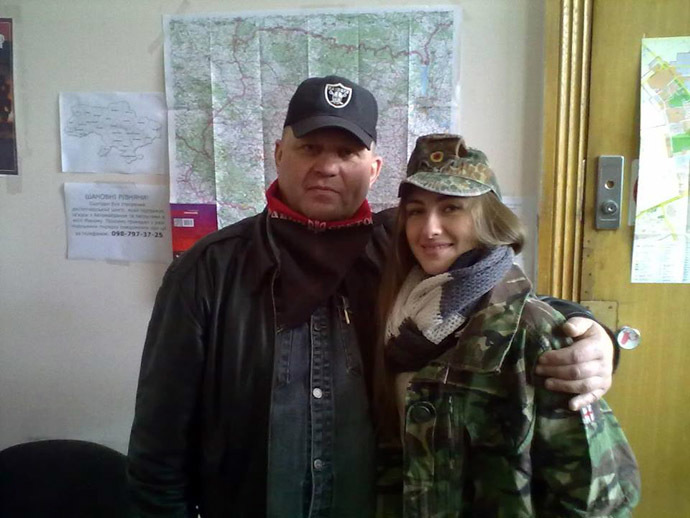 Right Sector coordinator Aleksandr Muzychko posing with a young member of nationalist organization.