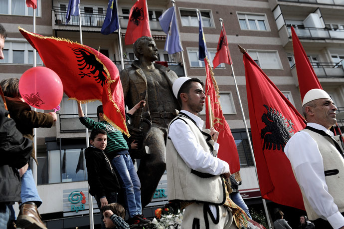 Kosovars hold Albanian flags as they take part in celebrations marking the 6th anniversary of Kosovo's declaration of independence from Serbia, in Pristina on February 17, 2014. (AFP Photo / Armend Nimani) 