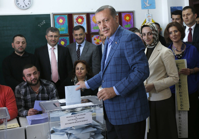 Turkey's Prime Minister Tayyip Erdogan casts his ballot at a polling station during the municipal elections in Istanbul March 30, 2014. (Reuters/Murad Sezer)