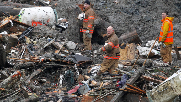 Rescuers face dangerous toxins in Washington state mudslide recovery operation