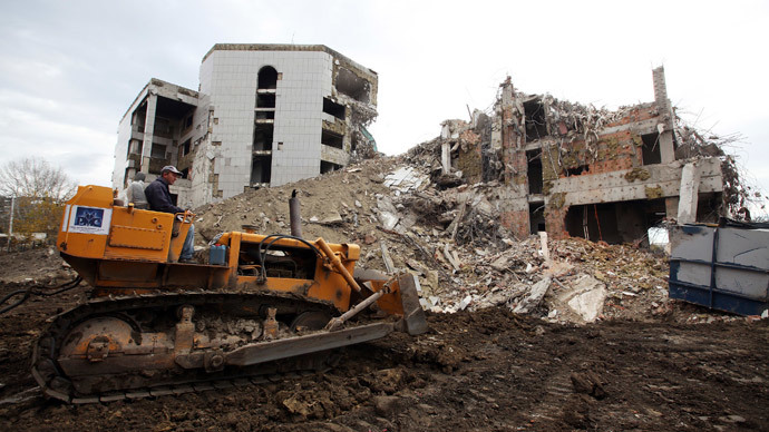 A worker operates a bulldozer during the demolition of the former Chinese embassy in Belgrade November 10, 2010.(Reuters / Marko Djurica)