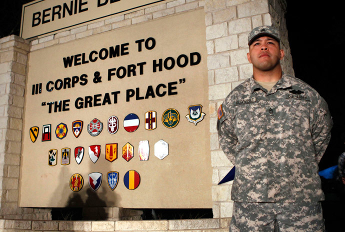 Sgt. First Class Erick Rodriguez stands guard before a news conference by Lt. Gen. Mark Milley at the entrance to Fort Hood Army Post in Texas April 2, 2014. (Reuters / Erich Schlegel)