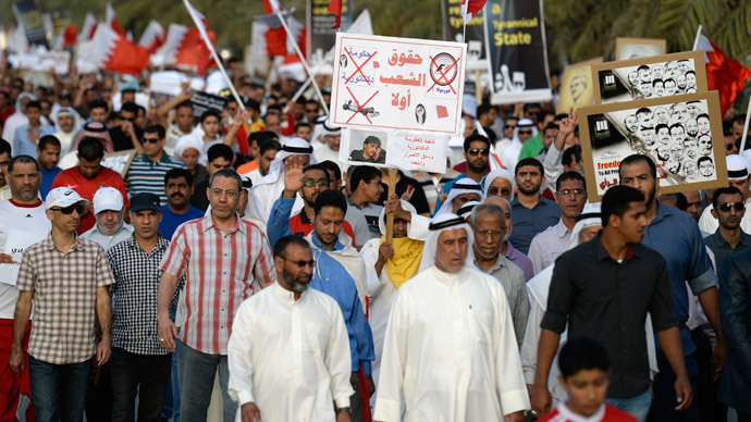 Protesters holding banner reading: "youth's rights first" as they march during an anti-government protest in Budaiya west of Manama, April 4, 2014.(Reuters / Stringer)