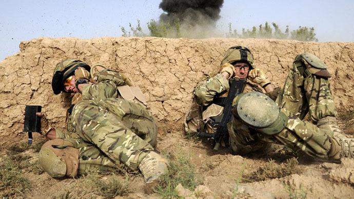British soldiers take cover as they shelter from a controlled explosion of an Improvised Explosive Device (IED) in a village of Sayedebad District, Nad e Ali, Helmand Province on July 31, 2010 (AFP Photo / Ministry of Defence / Corporal Barry Lloyd RLC)
