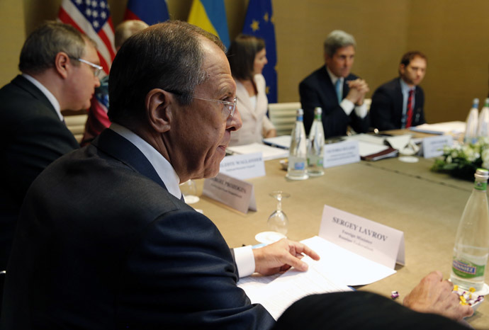 Russia's Foreign Minister Sergei Lavrov (L) looks on as U.S. Secretary of State John Kerry (2nd R) starts a quadrilateral meeting in Geneva, between representatives of the U.S., Ukraine, Russia and the European Union about the ongoing situation in Ukraine April 17, 2014. (Reuters/Jim Bourg)