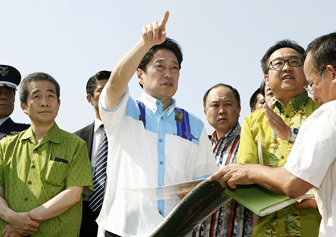 Japan's Defence Minister Itsunori Onodera (C) inspects the ground for a military lookout station in Yonaguni town, Okinawa prefecture, in this photo taken by Kyodo April 19, 2014. (Reuters / Kyodo)