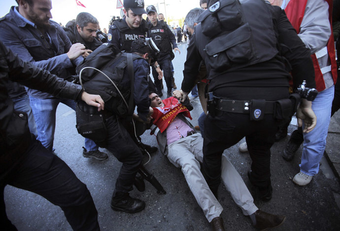 Riot police detain a union member during a protest against the government ban of May Day gathering in Taksim square in central Istanbul April 21, 2014. (Reuters)
