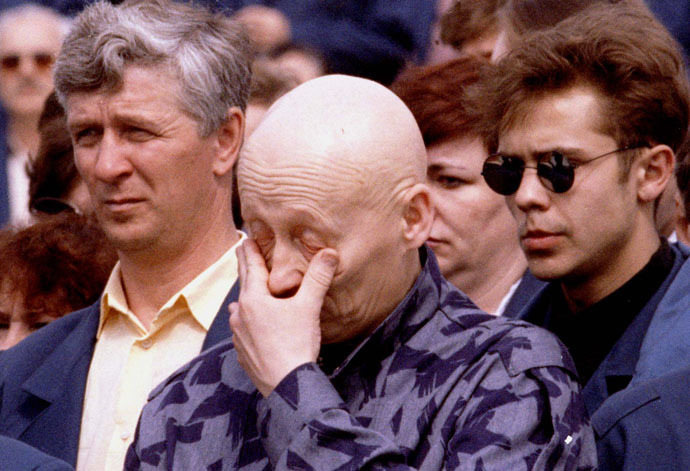 A worker of the Chernobyl nuclear power plant gives way to emotion during commemorations at the station marking the 10th anniversary of the explosion in the station's fourth reactor in Chernobyl April 26, 1996 (Reuters)