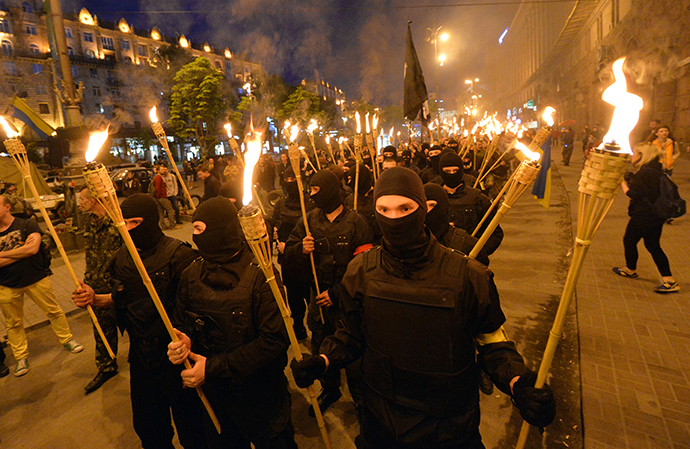 Unknown ultra-nationalists activists march towards the Independence Square to commemorate "Maidan heroes" in Kiev on April 29, 2014. (AFP Photo / Sergey Supinsky)