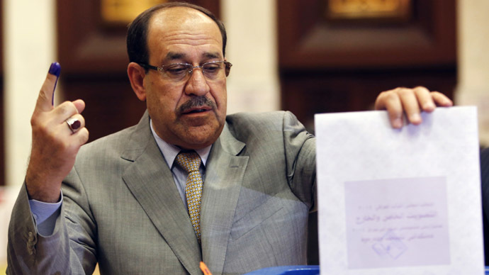 Iraq's Prime Minister Nouri al-Maliki casts his ballot during parliamentary election in Baghdad April 30, 2014. (Reuters/Ahmed Jadallah)