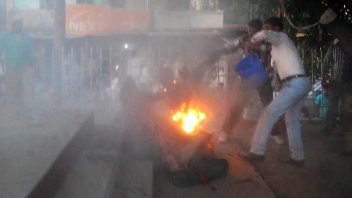 Horror show in India as debate spectator self-immolates, grabs politician
