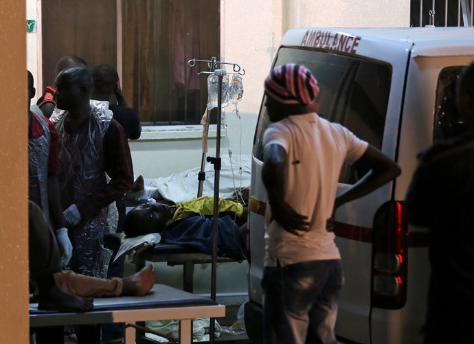 People who were injured during an explosion are taken into Asokoro General Hospital after arriving in ambulances, in Abuja May 1, 2014. (Reuters / Afolabi Sotunde)