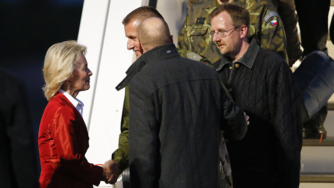 German Defence Minister Ursula von der Leyen (L) welcomes OSCE observers John Christensen (C) from Denmark Germany's Axel Schneider (2nd L) and unidentified observers in Berlin's Tegel airport, May 3, 2014. (Reuters / Fabrizio Bensch)