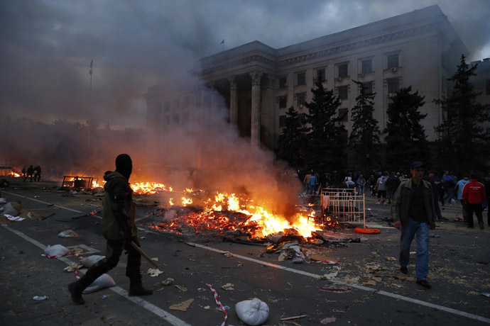 A protester walks past a burning pro-Russian tent camp near the trade union building in Odessa May 2, 2014. (Reuters/Yevgeny Volokin)