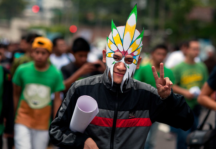 An activist gestures during a march demanding the legalization of marijuana in San Salvador, El Salvador on May 3, 2014. (AFP Photo/Jose Cabezas)